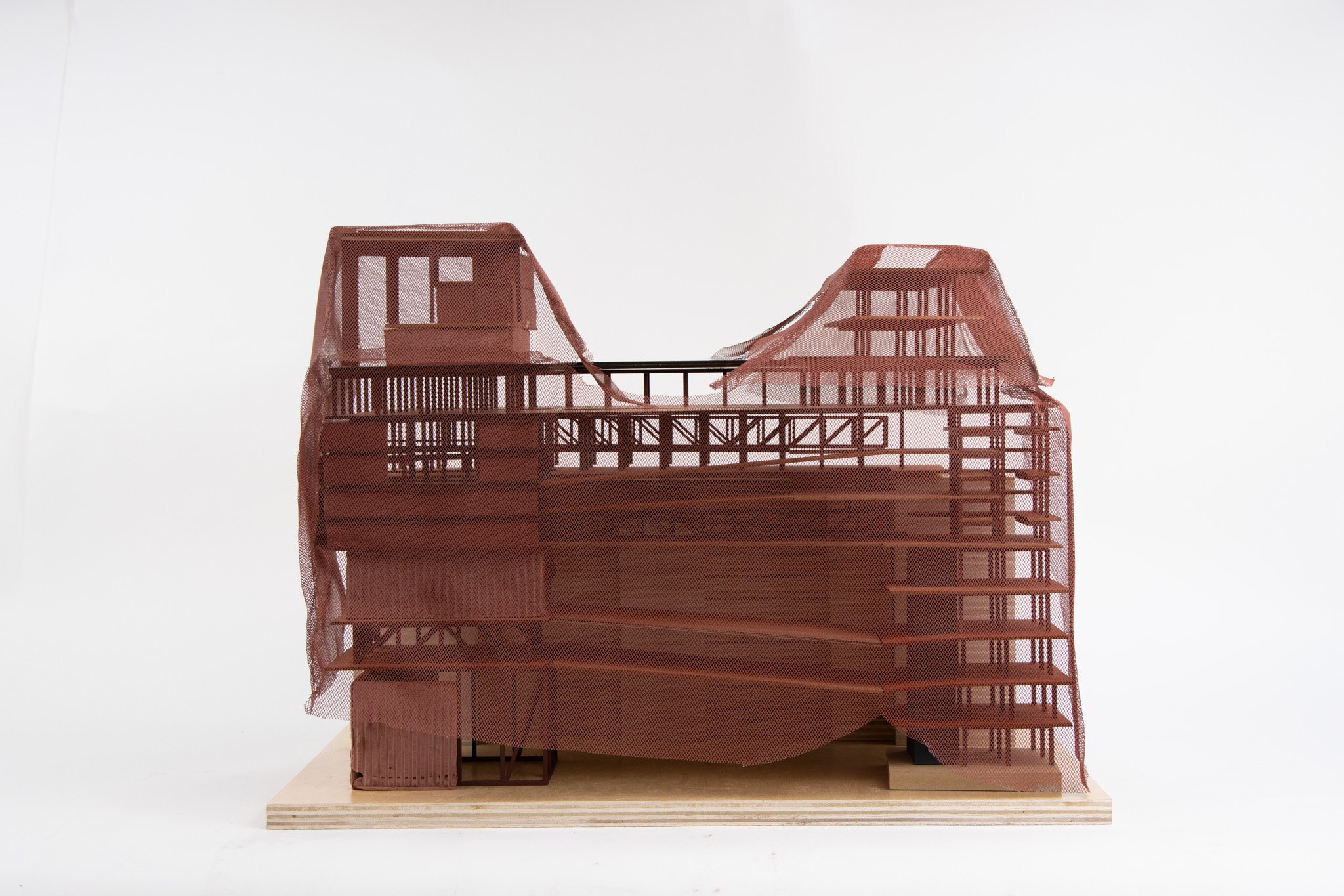 Final model with the mesh facade draped over the stacked program