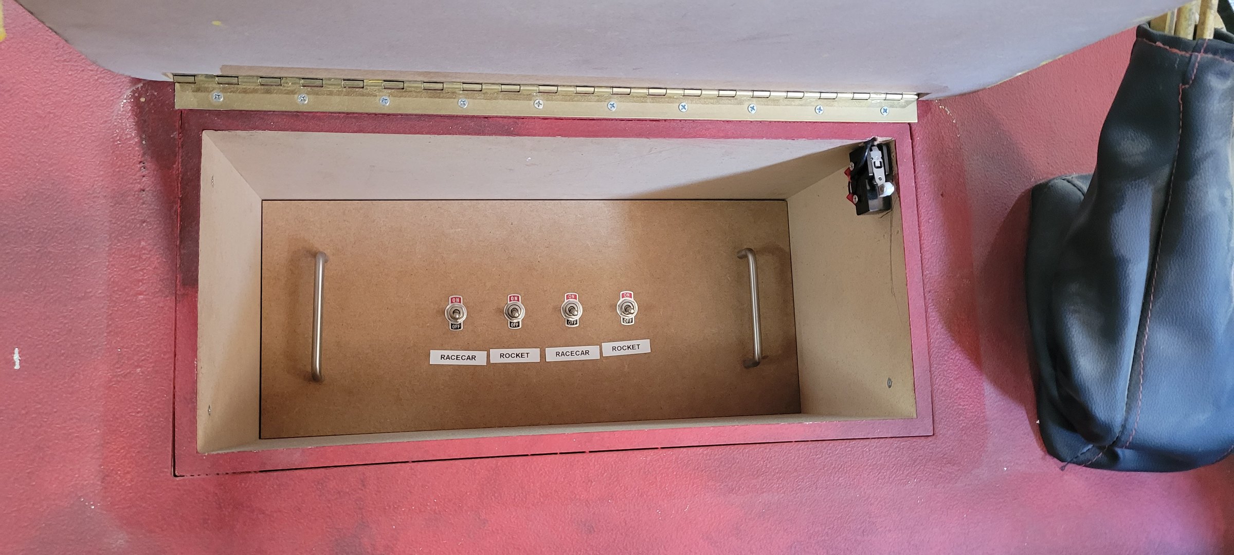 Service hatch opened to show the labeled control switches